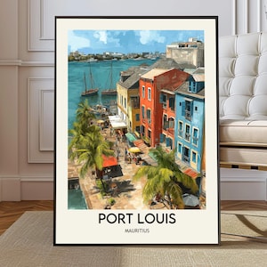 May include: A framed art print of Port Louis, Mauritius, featuring colorful buildings along a waterfront. The artwork depicts a vibrant scene with palm trees, boats, and the text "PORT LOUIS MAURITIUS" at the bottom. The sky is blue with clouds.