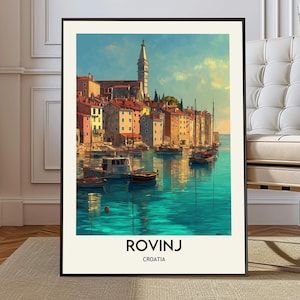 May include: A framed art print of Rovinj, Croatia, featuring colorful buildings along the coast, boats on turquoise water, and a tall church tower. The print has the text "ROVINJ CROATIA" at the bottom.