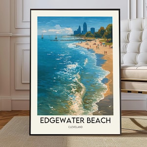 May include: A framed art print of Edgewater Beach in Cleveland. The artwork depicts a vibrant beach scene with blue water, a sandy shore, and people. The text "Edgewater Beach Cleveland" is at the bottom.