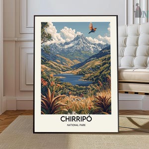 May include: A framed art print featuring a scenic landscape of Chirripó National Park. The artwork depicts a mountain range, a lake, and lush vegetation in shades of green, brown, and blue. A bird is flying in the sky. The text "CHIRRIPÓ NATIONAL PARK" is at the bottom.