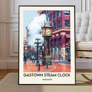 May include: A framed print of the Gastown Steam Clock in Vancouver. The artwork depicts a street scene with a large clock tower, steam, and people. The buildings are red and purple, and the text "Gastown Steam Clock Vancouver" is at the bottom.
