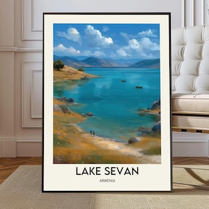 May include: Framed art print of Lake Sevan in Armenia. The landscape painting depicts a serene lake with turquoise water, rolling hills, and a bright blue sky with fluffy white clouds. The words "LAKE SEVAN ARMENIA" are printed at the bottom.