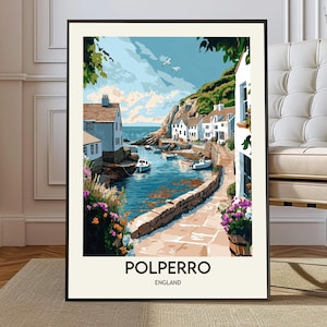 Puede incluir: Una impresión artística enmarcada de Polperro, Inglaterra, que representa un pueblo costero. La obra de arte muestra edificios blancos, barcos en el puerto y un paseo marítimo de piedra. El cielo es azul con nubes y gaviotas. La impresión tiene un marco negro.