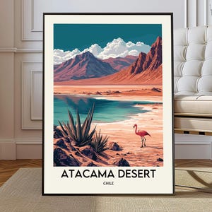May include: A framed art print of the Atacama Desert in Chile. The landscape features a lake with turquoise water, a pink flamingo, and mountains under a blue sky with white clouds. The print includes the text "ATACAMA DESERT" and "CHILE".