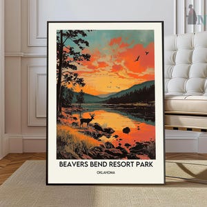 May include: A vintage-style poster with a scenic view of a lake and forest at sunset. The poster features a silhouette of a deer in the foreground and the text "BEAVERS BEND RESORT PARK OKLAHOMA".