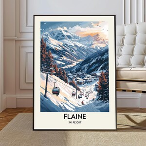 May include: A framed print depicting a snowy mountain ski resort. The image shows a ski lift, skiers, and a village in a valley. The text "FLAINE SKI RESORT" is at the bottom. The artwork uses blues, whites, and oranges to create a winter scene.