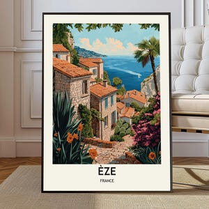Puede incluir: Una impresión artística enmarcada de Èze, Francia, que representa un pueblo costero. La obra muestra edificios de piedra con tejados de tejas naranjas, exuberante vegetación y una vista del mar azul. La impresión incluye el texto "ÈZE FRANCE" en la parte inferior.