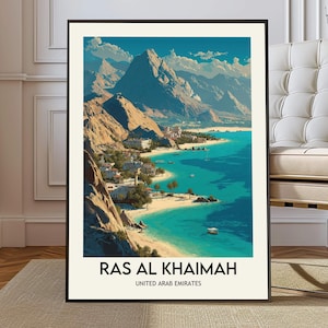 May include: A framed art print of Ras Al Khaimah, United Arab Emirates. The artwork depicts a coastal landscape with turquoise waters, sandy beaches, and beige mountains under a blue sky. The print includes the text "RAS AL KHAIMAH" and "UNITED ARAB EMIRATES".