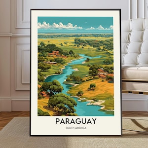 May include: A framed art print featuring a vibrant landscape of Paraguay, South America. The artwork depicts a winding river, lush green fields, and small buildings under a blue sky with fluffy clouds. The word "PARAGUAY" is printed at the bottom.