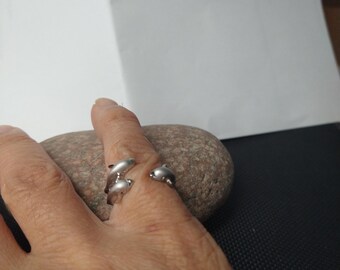 Do you love dolphins? This is a Sterling Silver ring with unique design of dolphins.