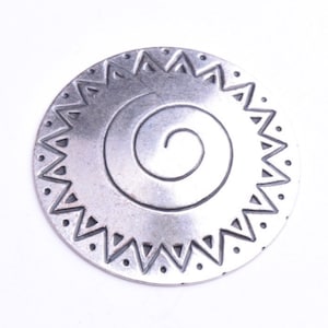 May include: Silver pendant with a spiral design inside a sunburst pattern.
