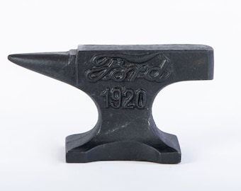 May include: A black cast iron anvil with the word "Ford" and the year "1920" embossed on the side.