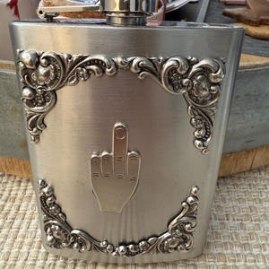 Flask with an attitude , our own custom design , sold  1 ea made in USA