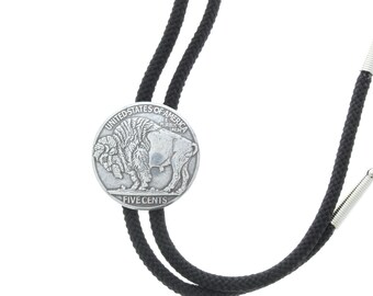 May include: A black bolo tie with a silver buffalo nickel charm. The charm features the words "United States of America" and "Five Cents".