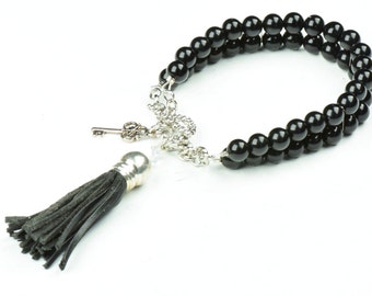 Black beaded bracelet with tassel, each