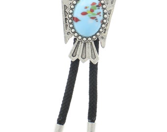 May include: A silver bolo tie featuring a Native American inspired eagle design with a blue and red stone in the center. The tie is on a black cord.