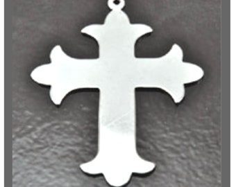 May include: A silver metal cross with a decorative design. The cross has a simple, elegant shape with a slightly ornate design at the top and bottom.