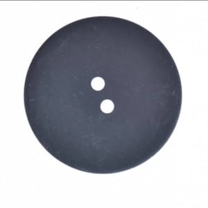 May include: A black round button with two white holes in the center.
