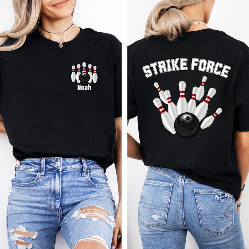 May include: Black t-shirt with a bowling theme. The front features a bowling pin design with the name "Noah" below. The back of the shirt displays the words "STRIKE FORCE" above a bowling ball and pins graphic. The shirt is worn by a person wearing blue jeans.