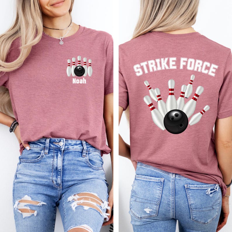 May include: Mauve t-shirt with a bowling pin and ball graphic. The front of the shirt has a bowling pin and ball design with the name "Noah" below. The back of the shirt features the text "STRIKE FORCE" above a bowling ball and pins.