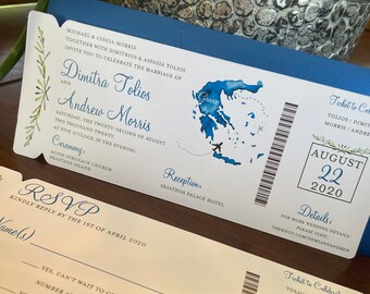 May include: A blue and white wedding invitation in the shape of a plane ticket. The invitation features a watercolor illustration of Greece and the text "Ticket to Celebrate" with the names Dimitra Tolios and Andrew Morris. The date of the wedding is August 22, 2020.