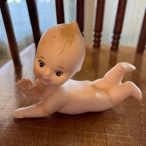 Antique Porcelain Kewpie Baby Laying Down Waving #8223