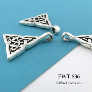 May include: Three silver Celtic knot triangle pendants with a loop at the top for hanging. The pendants are on a blue background. PWT 636 &copy;BlueEchoBeads