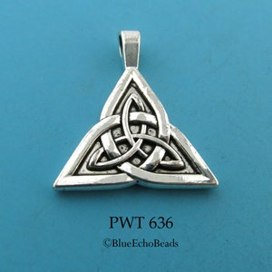 May include: Silver Celtic knot pendant in the shape of a triangle. The knot is intricate and detailed. The pendant has a loop at the top for hanging.