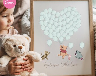 May include: A framed print featuring a heart-shaped arrangement of light green balloons. Below, illustrations of Winnie the Pooh characters are depicted. The text "Welcome Little One" is written in cursive. The frame is made of light-colored wood.