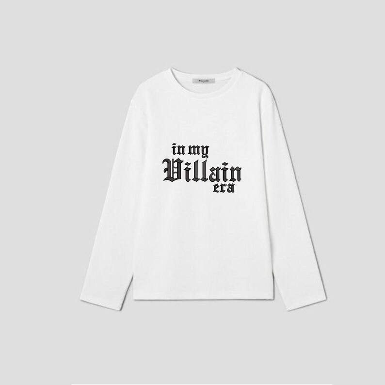 May include: White long-sleeve t-shirt with black text that reads "in my Villain era".