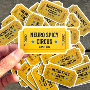 May include: A close-up of a stack of yellow paper tickets with the text "Neuro Spicy Circus" and "Admit One".