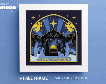 May include: A blue and yellow paper cut-out design of the nativity scene with the text "O Holy Night".
