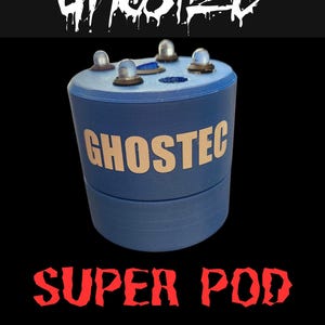 May include: A blue cylindrical device with the word "GHOSTEC" in white lettering. The device has four clear, dome-shaped lights on top. Below the device, the words "SUPER POD" and "GHOST DETECTOR" are displayed in red and white, respectively, against a black background.