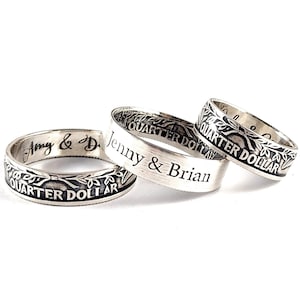 May include: Three silver rings with the words "Quarter Dollar" engraved on the outside and personalized inscriptions on the inside. The rings read "Amy & D", "Jenny & Brian", and "Quarter Dollar".