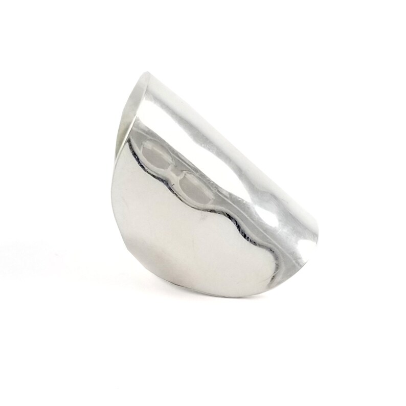 May include: A silver ring with a hammered finish and a curved shape.