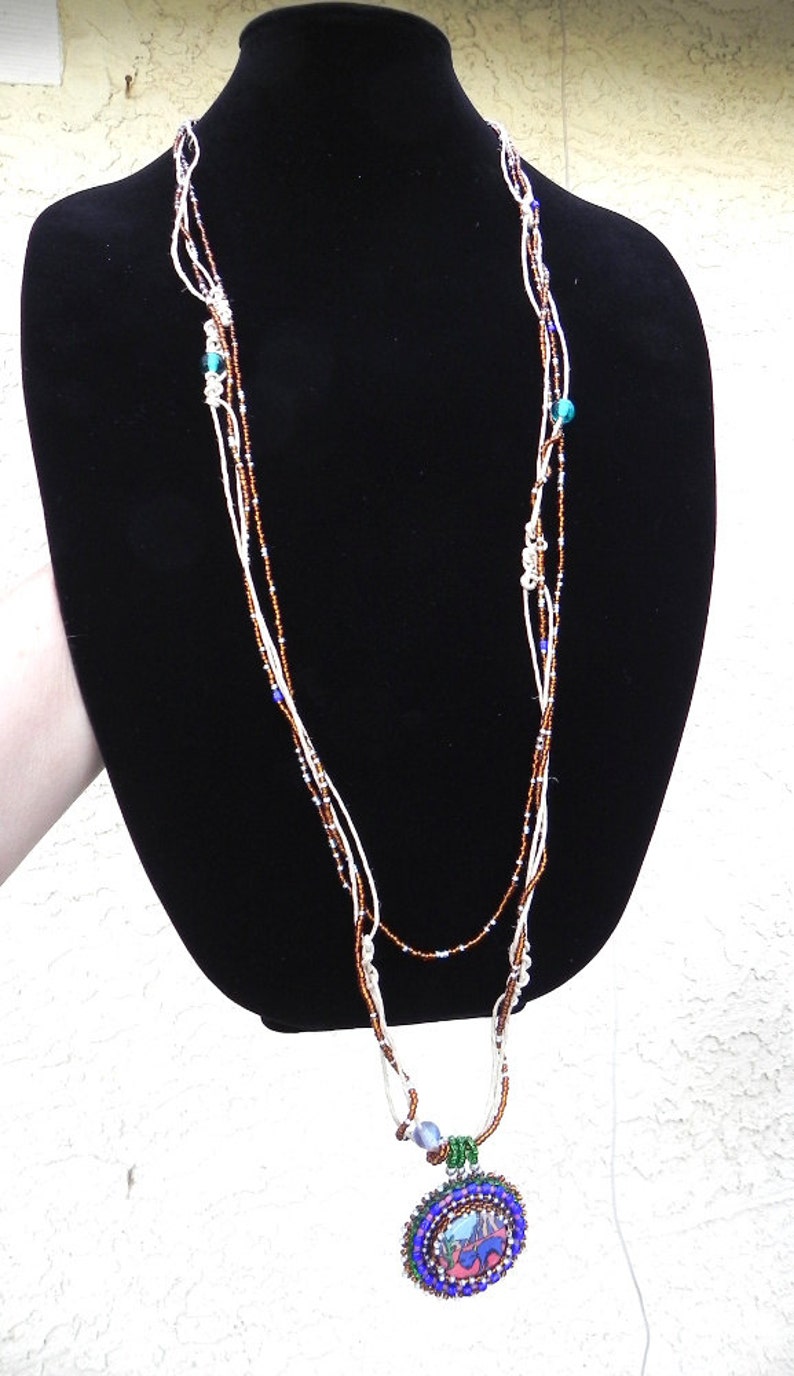N203 desert art blue whimsical coyote necklace cartoony wearable art coyote art jewelry unusual blue coyote necklace