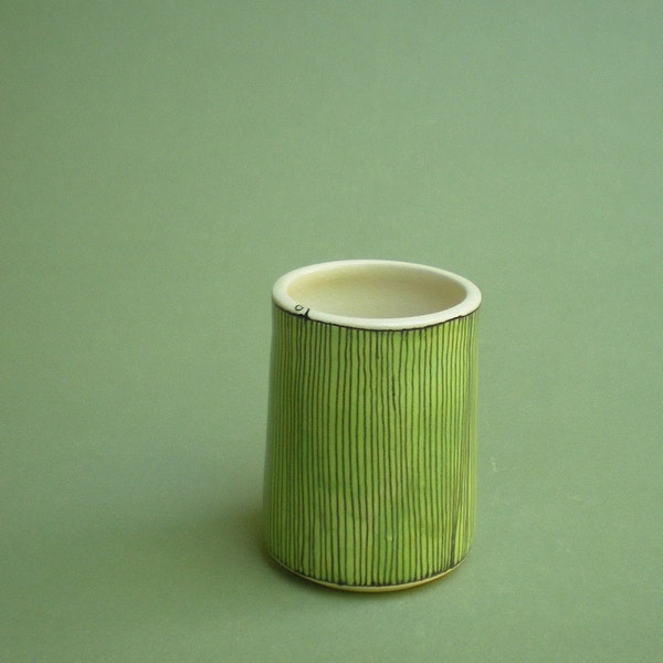 cup with green pinwheel design