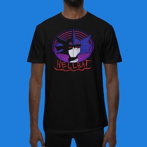May include: Black t-shirt with a graphic of a blue and purple creature with the text "HELLBAT" in red.