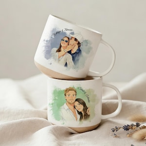 May include: Two off-white ceramic mugs with a speckled texture and a natural clay base. The top mug features a watercolor illustration of a couple with the text Kathryn & Hassan. The bottom mug displays a couple illustration with the text Carol & Estelle.