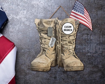 May include: Tan military boots with laces and a dog tag that says "NAME". A small American flag hangs above the boots. The boots have a circular emblem that says "CUSOM BRANCH".