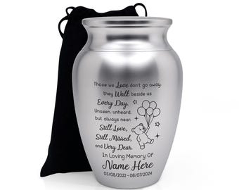 May include: A silver-colored urn with a black drawstring bag. The urn has engraved text and a teddy bear holding balloons. The text reads "Those we Love don't go away... In Loving Memory Of Name Here 03/08/2022-08/07/2024."