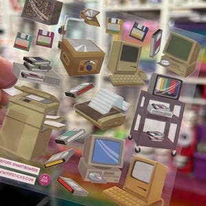 May include: A clear sticker sheet featuring retro office technology illustrations including beige desktop computers, floppy disks, VHS tapes, a dot matrix printer, a photocopier, and an overhead projector. Text reads BEFORE SMARTBOARDS and JUL 2026.