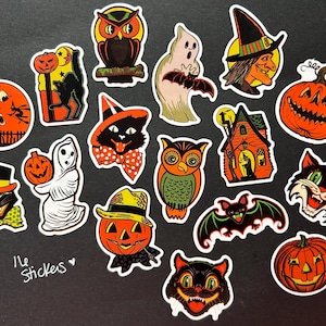 May include: A set of 14 Halloween themed stickers featuring various characters and objects, including owls, ghosts, pumpkins, a witch, a haunted house, and a black cat. The stickers are printed on white paper with a glossy finish.