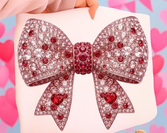 May include: A large, white bow adorned with sparkling red and clear crystals. The bow features a central knot and heart-shaped accents, creating a glamorous and festive design. The bow is held up by a person.