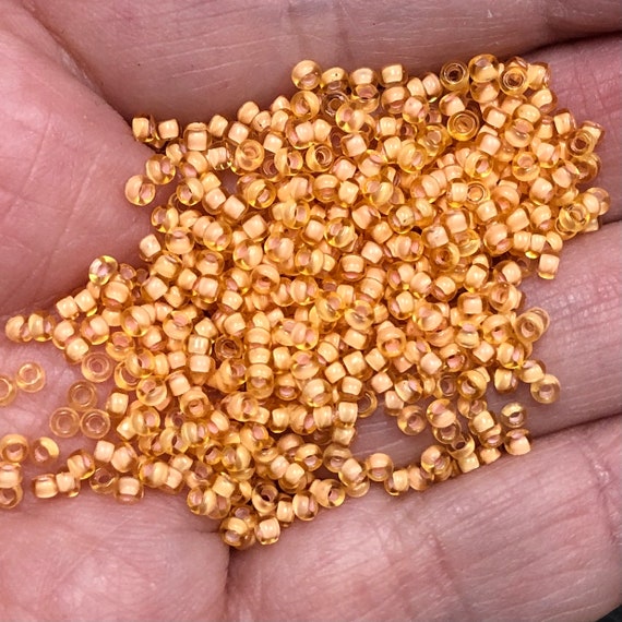 11/0 Japanese Seed Beads - Semi Matte Peach Lined Lt Topaz