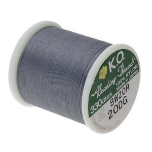 May include: A spool of gray nylon beading thread, labeled "K.O. Reading Thread 330dtex 100% NYLON Made in Japan LOT BW20R COL 20DG KOBAYASHI CO.,LTD."
