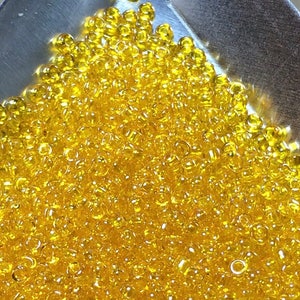 11/0 Japanese Seed Beads - Transparent Light Orange Luster Matsuno # 164 (5&quot; round tube, approx 24 grams)