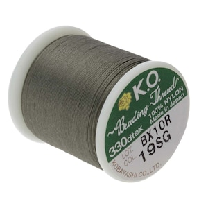 May include: A spool of gray nylon beading thread, labeled "K.O. Beading Thread 330dtex 100% Nylon Made in Japan" with the lot number "BX10R" and color number "19SG".