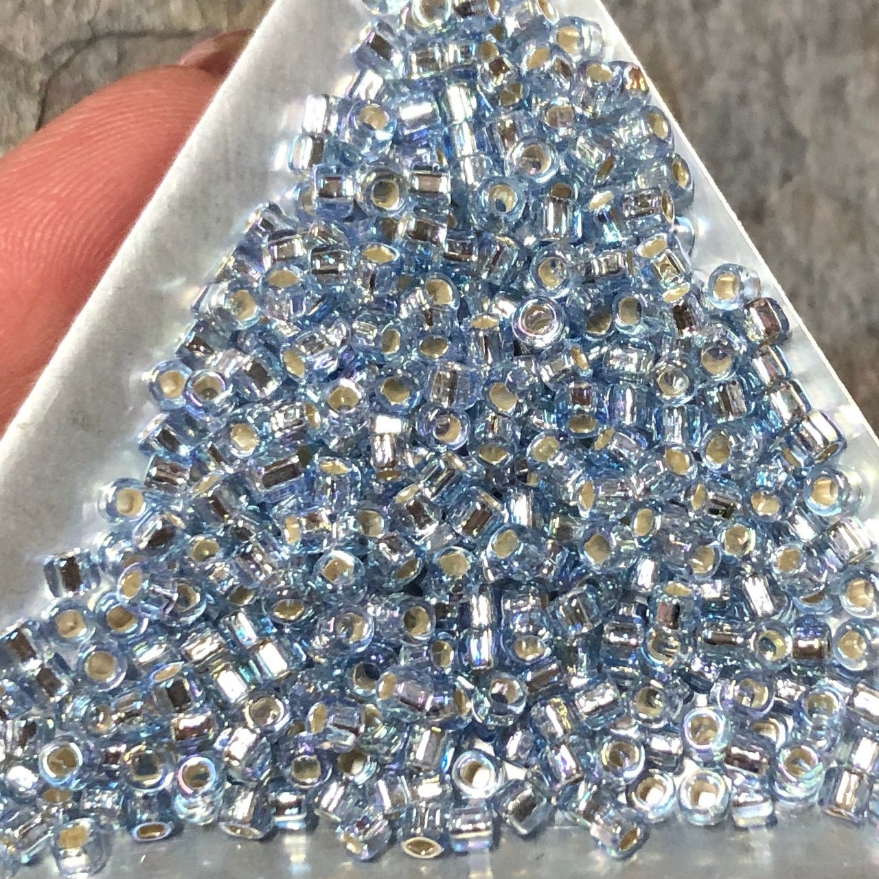 11-359, Miyuki 22g Pale Blue Lined Lt Topaz AB 11-359, Miyuki 22g Pale Blue Lined Lt Topaz AB