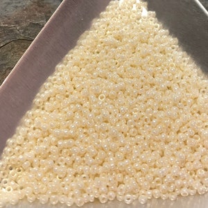 15/0 Japanese Seed Beads - Cream Ceylon Miyuki # 594 (2&quot; round tube, approx 8.2 grams)